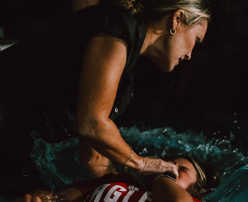 Woman baptizing another woman