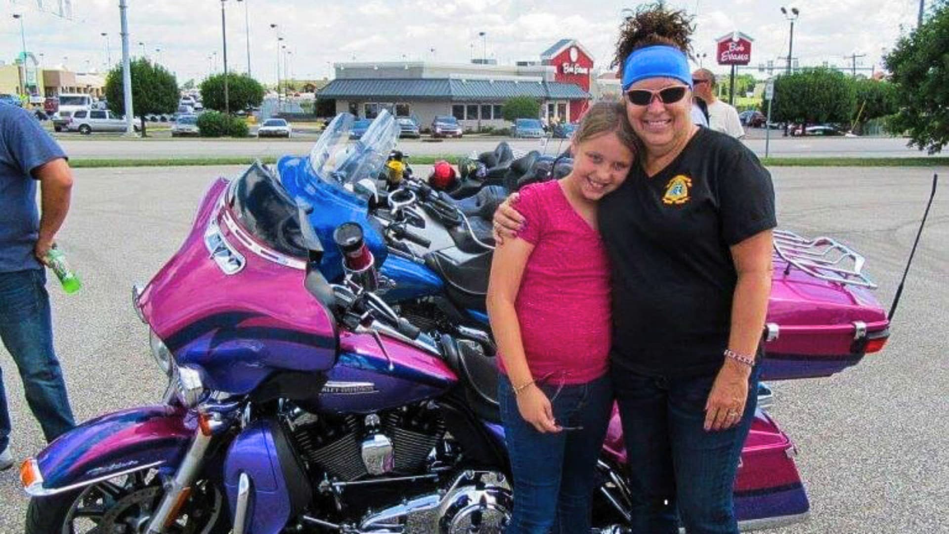 Big Sister Briana Kessler poses with Little Sister Makia at an Christian Motorcycle Association event.