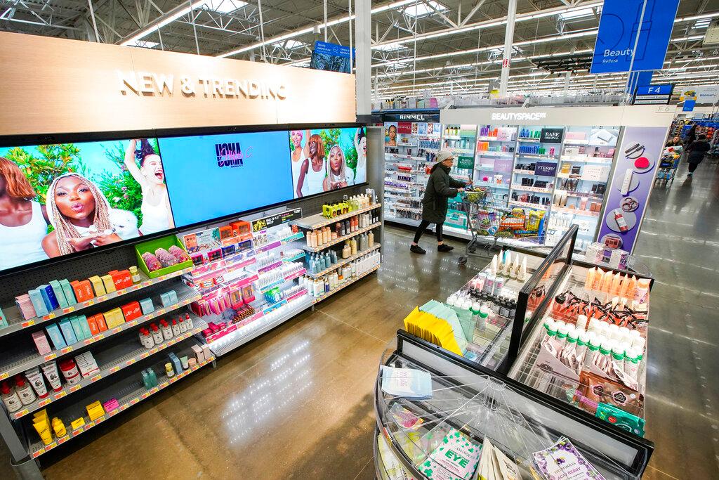 Shopper passes items inside the Walmart Supercenter in North Bergen, N.J.