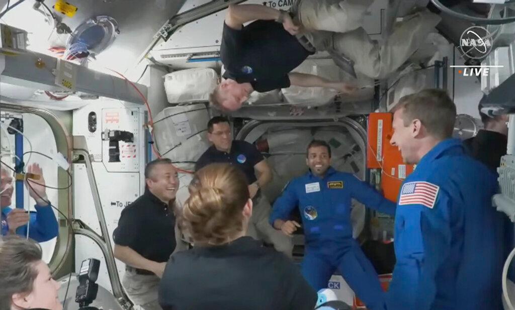 In this image from NASA TV, the four astronauts including United Arab Emirates' Sultan al-Neyadi, centre right, enter the pad of the International Space Station, Friday, March 3, 2023. A new crew from the United States, Russia and United Arab Emirates has arrived at the International Space Station.