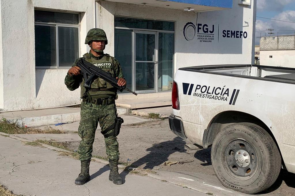 A Mexican army soldier guards the Tamaulipas State Prosecutor's headquarters in Matamoros, Mexico