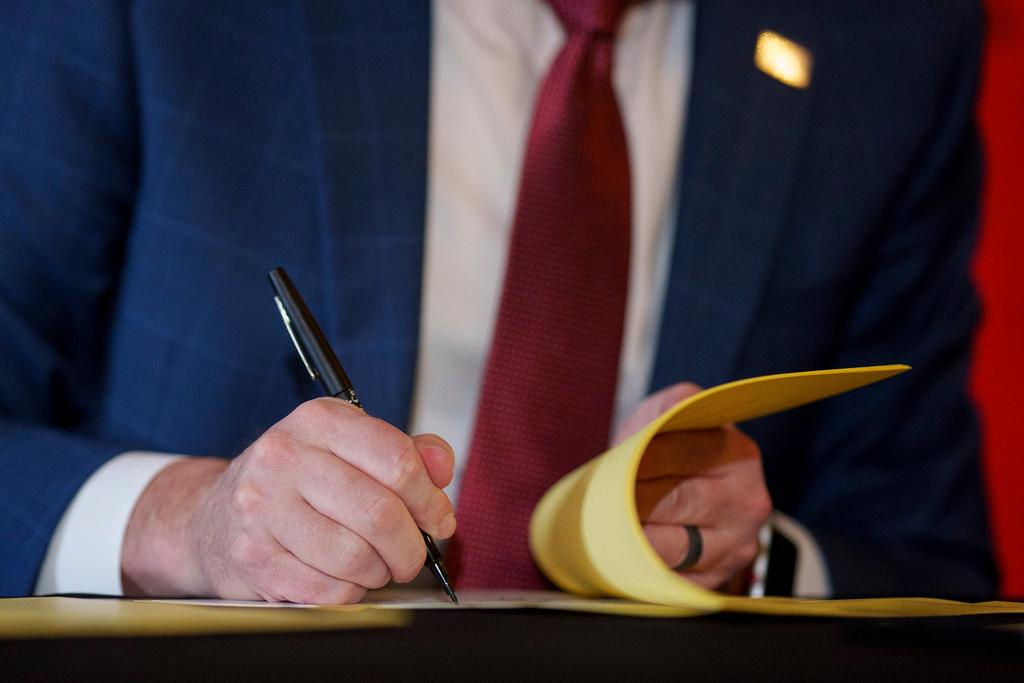 Gov. Spencer Cox signs two social media regulation bills during a ceremony at the Capitol building in Salt Lake City