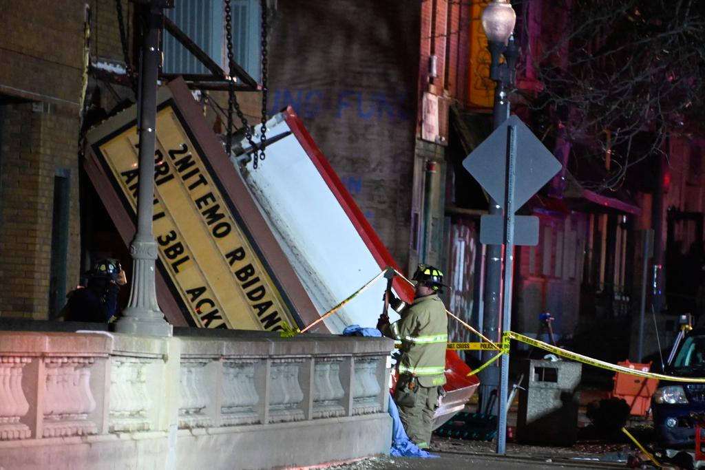 Authorities work the scene at the Apollo Theatre after a severe spring storm caused damage and injuries during a concert, late Friday, March 31, 2023, in Belvidere, Ill.