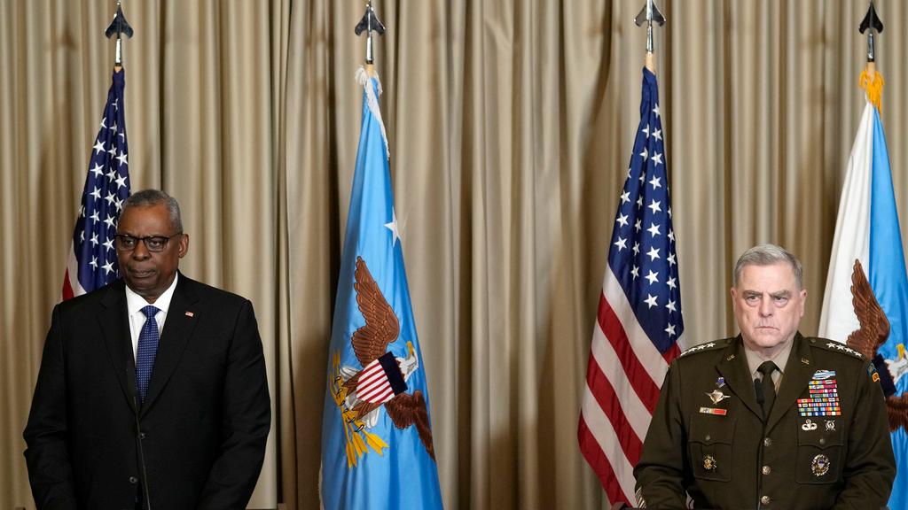 U.S. Defense Secretary Lloyd Austin and Chairman of the Joint Chiefs of Staff Mark Milley, from left, watching the media after the meeting of the 'Ukraine Defense Contact Group' at Ramstein Air Base in Ramstein, Germany