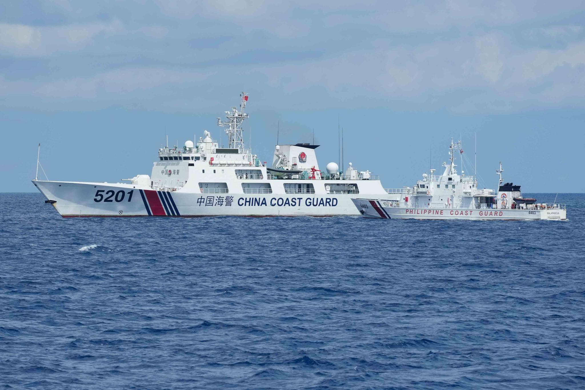 A Chinese Coast Guard ship with bow number 5201 blocks Philippine Coast Guard ship BRP Malapascua as it maneuvers to enter the mouth of the Second Thomas Shoal locally known as Ayungin Shoal at the South China Sea on Sunday, April 23, 2023.