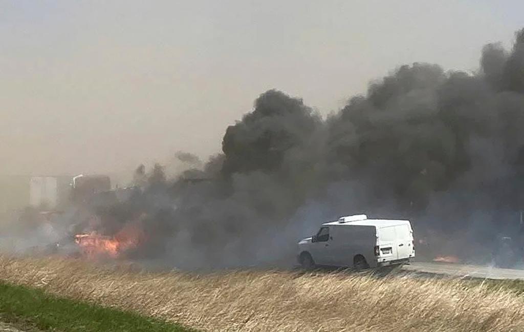 Smoke billows after a crash involving at least 20 vehicles shut down a highway in Illinois,