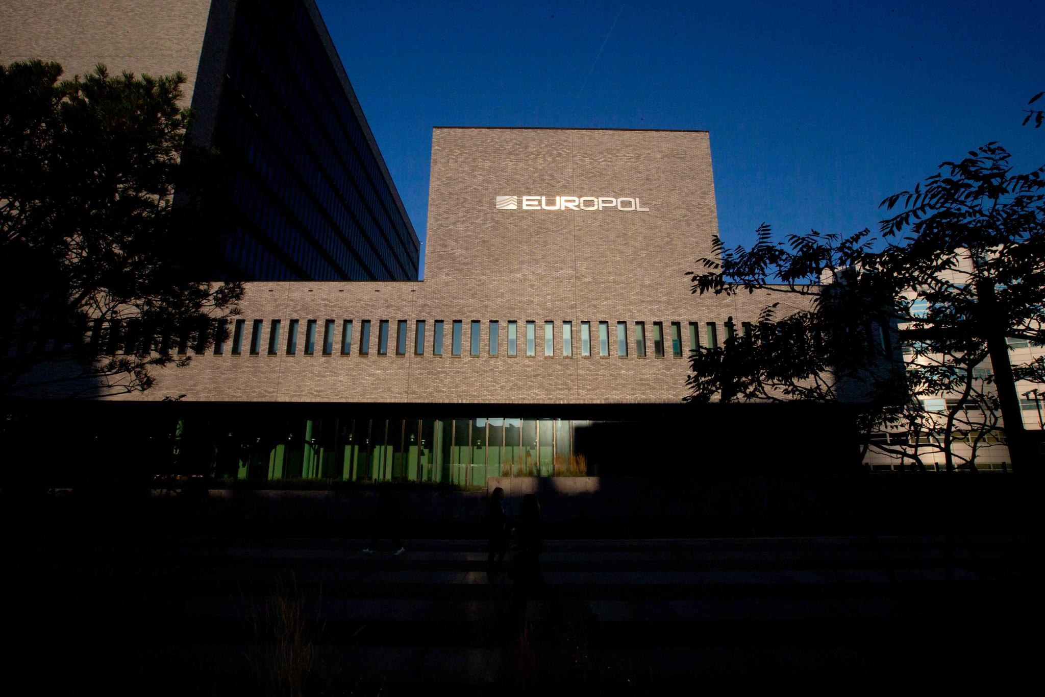 This Wednesday, Oct. 10, 2018, file photo shows the sun bouncing off the Europol headquarters in The Hague, Netherlands.