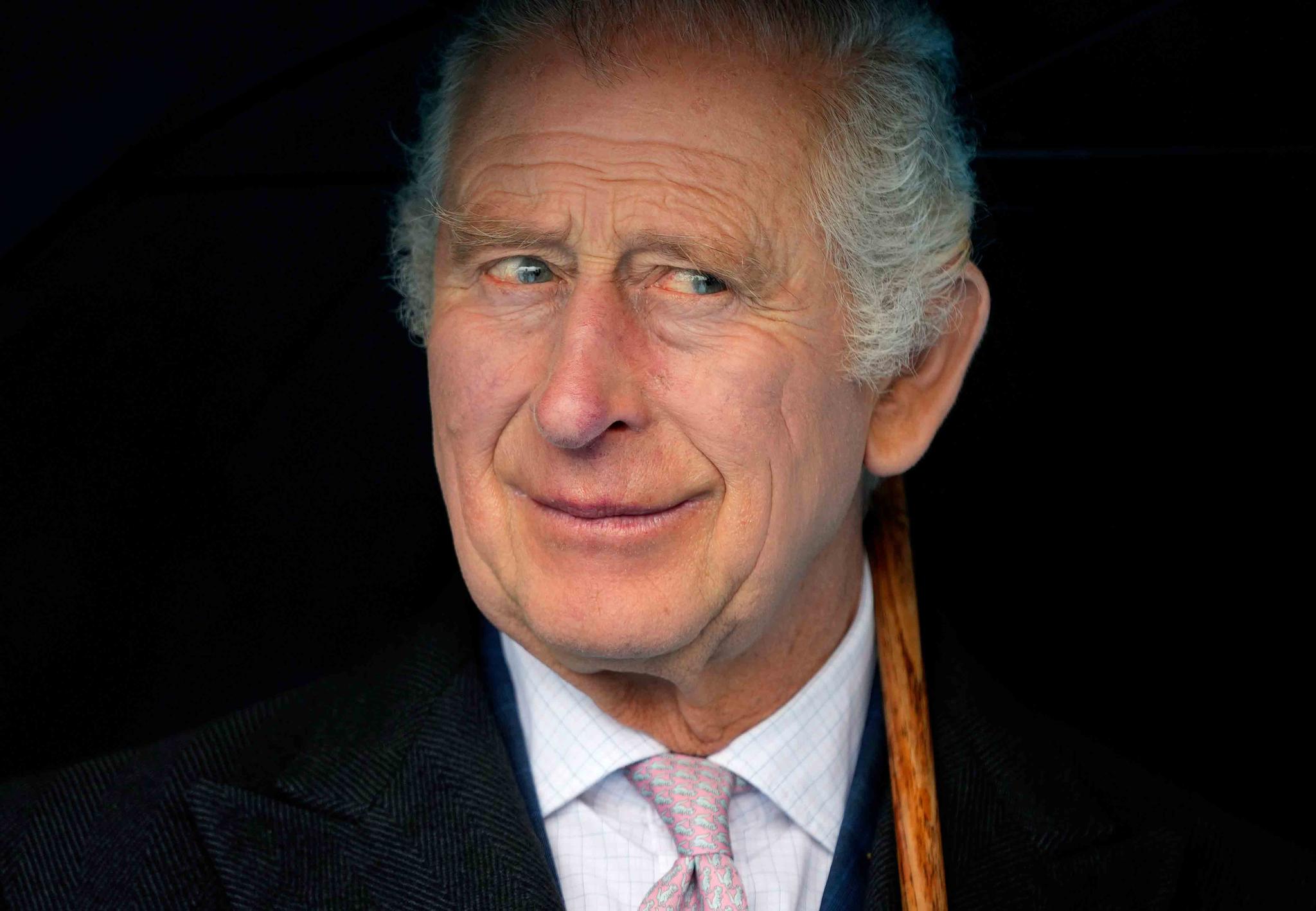 Britain's King Charles III smiles during a boat trip, in Hamburg, Germany, Friday, March 31, 2023.