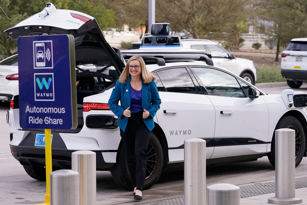 Phoenix Mayor Kate Gallego arrives in a self-driving vehicle