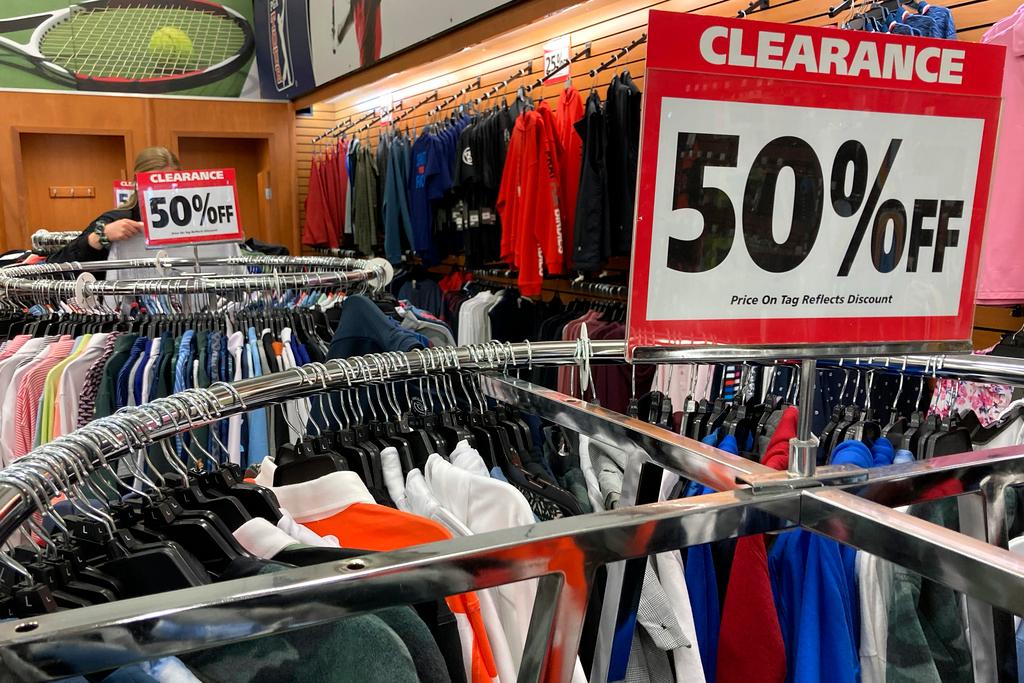 Clearance sale signs are displayed at a retail store