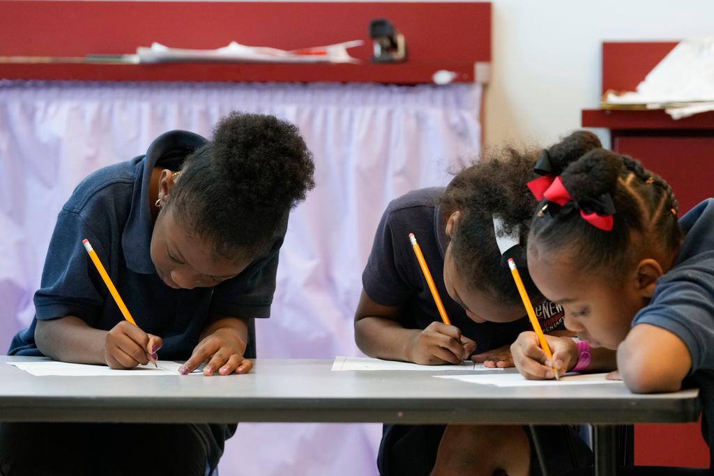 Second grade students write during class at Schaumburg Elementary