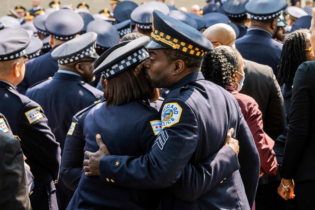 Chicago police officers embrace outside Trinity United Church of Christ before a funeral service for Chicago Police Officer Aréanah Preston