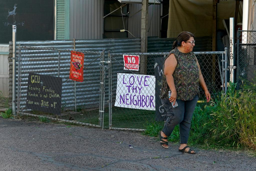 Alondra Ruiz Vazquez walks outside her home at the Periwinkle Mobile Home Park, Thursday, April 11, 2023, in Phoenix. Residents of the park are facing an eviction deadline of May 28 due to a private university's plan to redevelop the land for student housing.