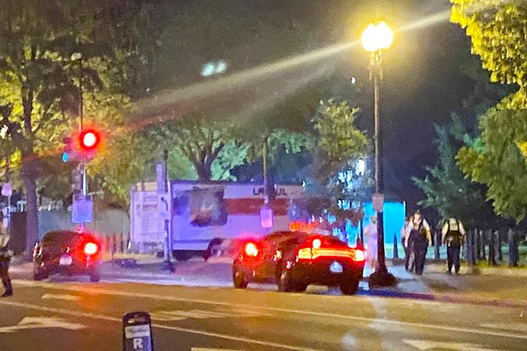 A box truck is seen crashed into a security barrier at a park across from the White House