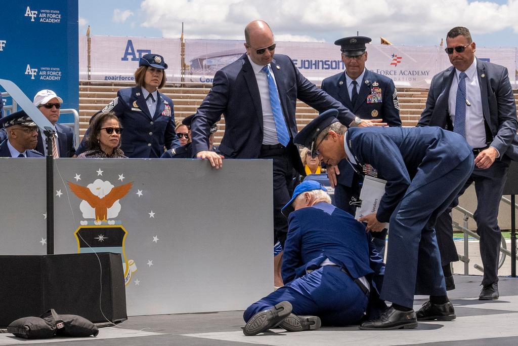 President Joe Biden falls on stage during the 2023 United States Air Force Academy Graduation Ceremony at Falcon Stadium