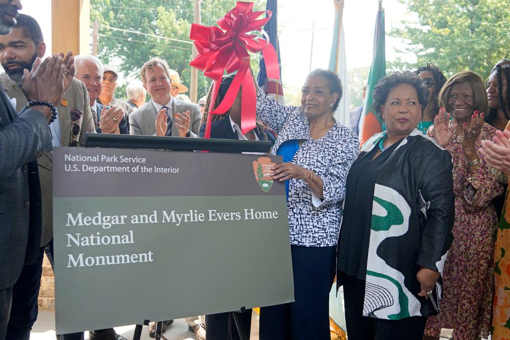 Myrlie Evers and daughter Reena Evers-Everette unveil the new park sign for Medgar and Myrlie Evers Home National Monument in Jackson, Miss.