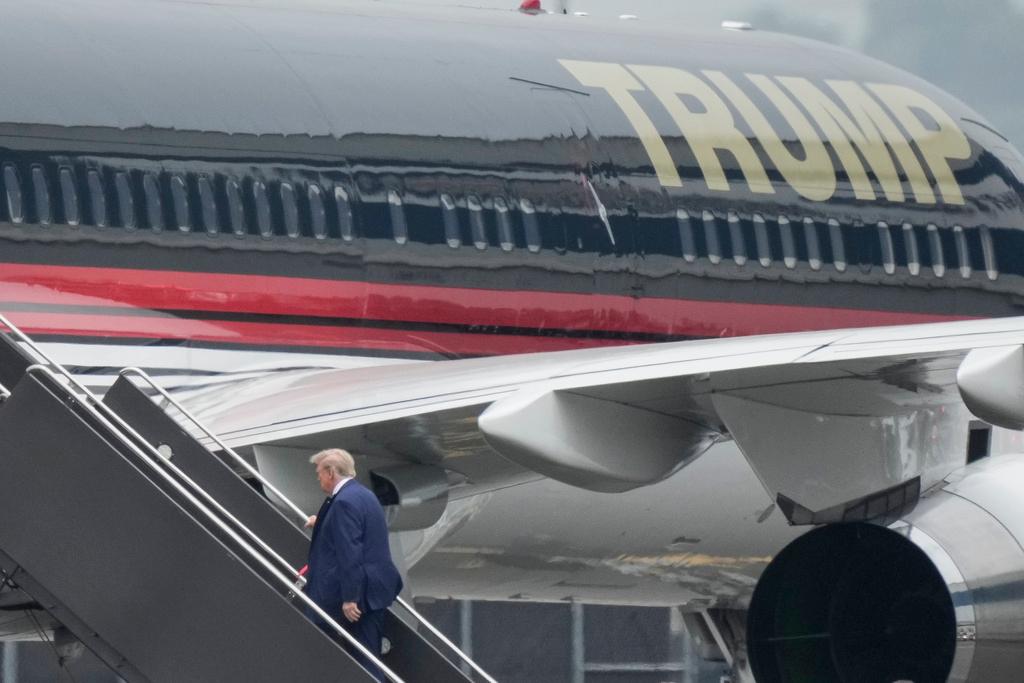 Former President Donald Trump boards his airplane at Newark Liberty International Airport