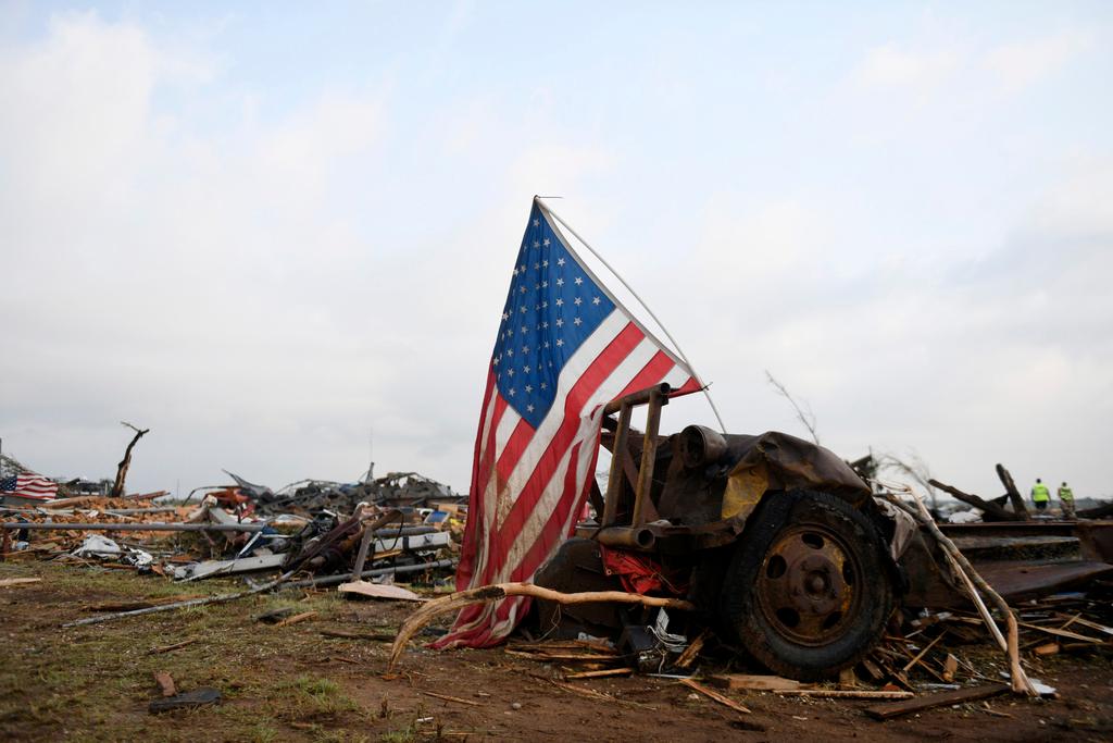 An American flag is seen among debris after a tornado in Matador, Texas