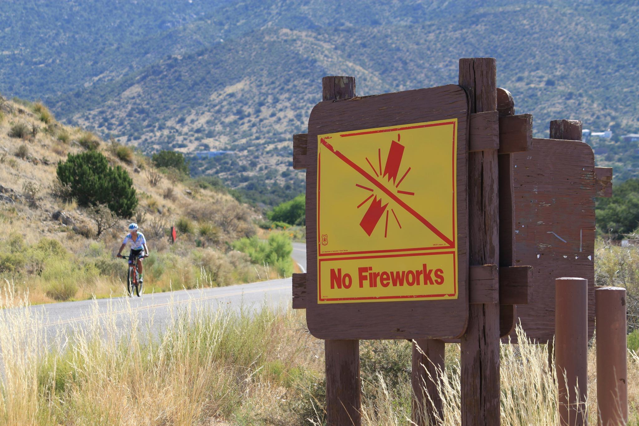 This June 30, 2023 image shows a sign prohibiting fireworks in the Sandia Mountains that border Albuquerque, New Mexico.