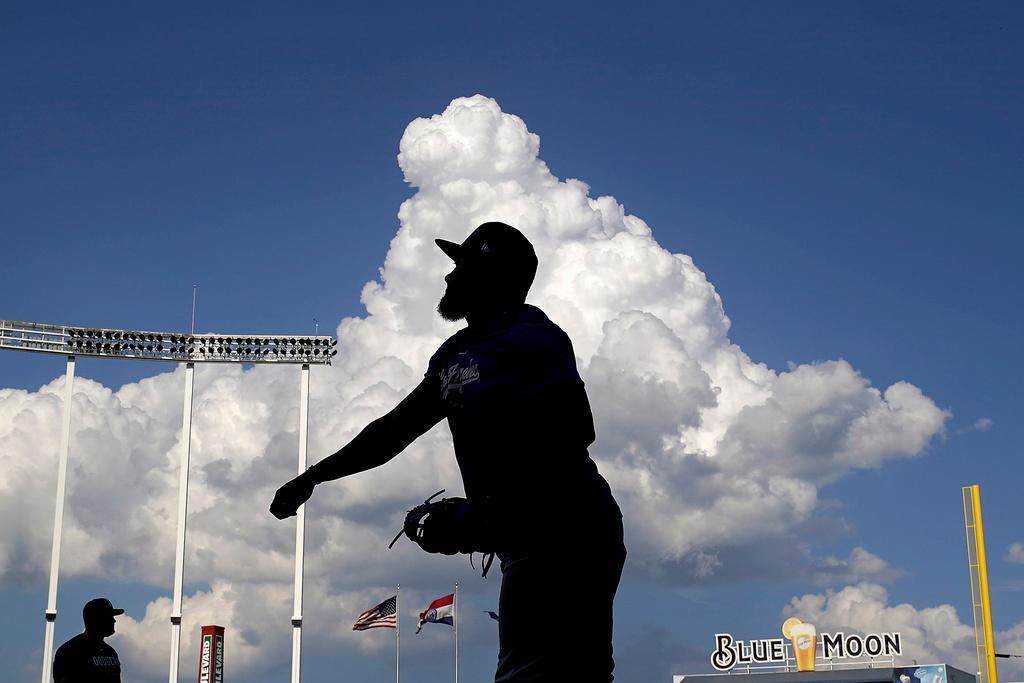 Los Angeles Dodgers third baseman Yonny Hernandez warms up before a baseball game against the Kansas City Royals