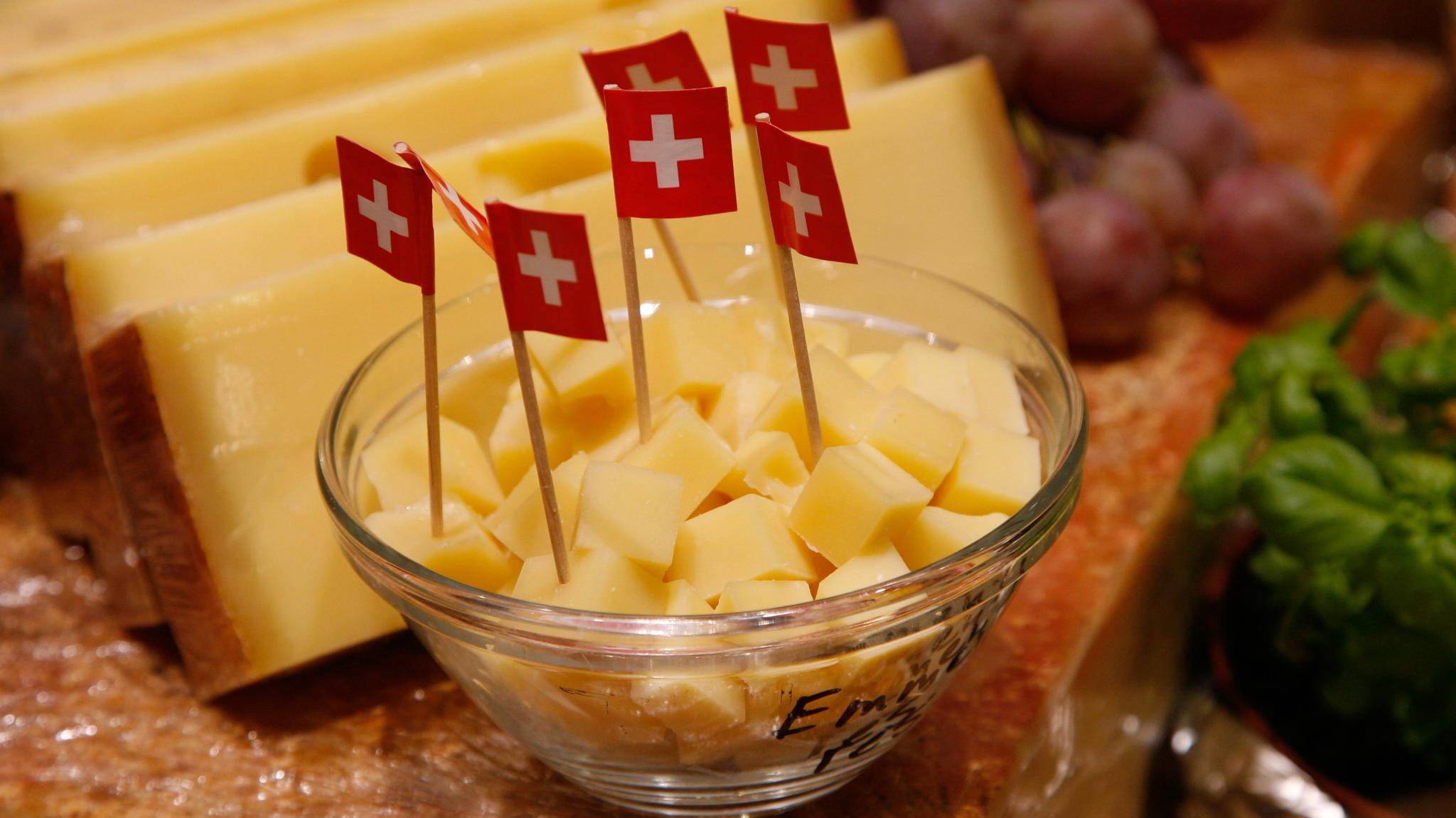 Cheese with tiny Swiss flags on toothpicks