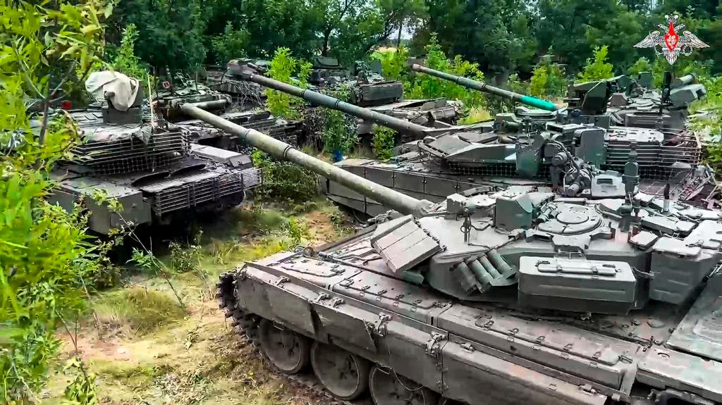 Tanks belonging to Russia's Wagner military contractor are parked ahead of their handover to the Russian military