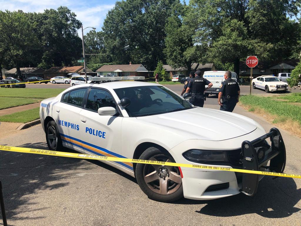 Memphis police officers work the scene of an officer-involved shooting at Jewish school