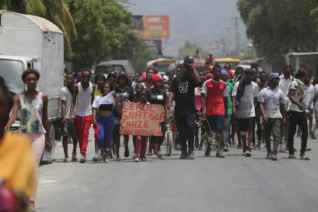 People march to demand the freedom of New Hampshire nurse Alix Dorsainvil and her daughter, who have been reported kidnapped, in the Cite Soleil neighborhood of Port-au-Prince, Haiti