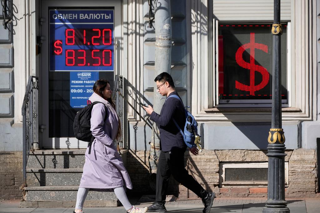 Exchange office screen showing the currency exchange rates of U.S. Dollar to Russian Rubles in St. Petersburg, Russia