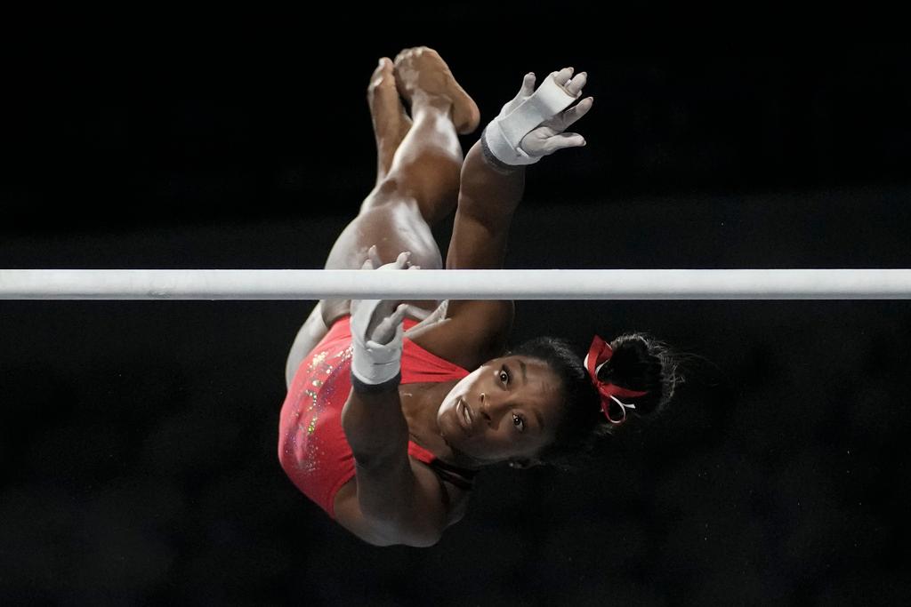 Simone Biles, a seven-time Olympic medalist and the 2016 Olympic champion, practicers on the uneven bars at the U.S. Classic gymnastics competition 