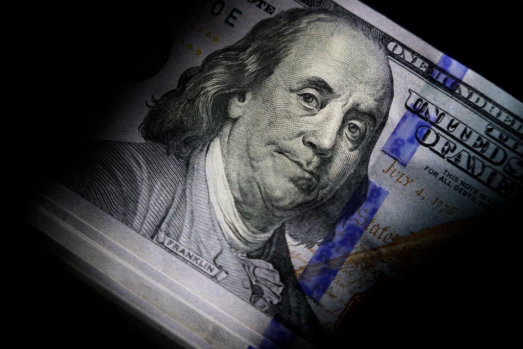 The likeness of Benjamin Franklin is seen on U.S. $100 bills