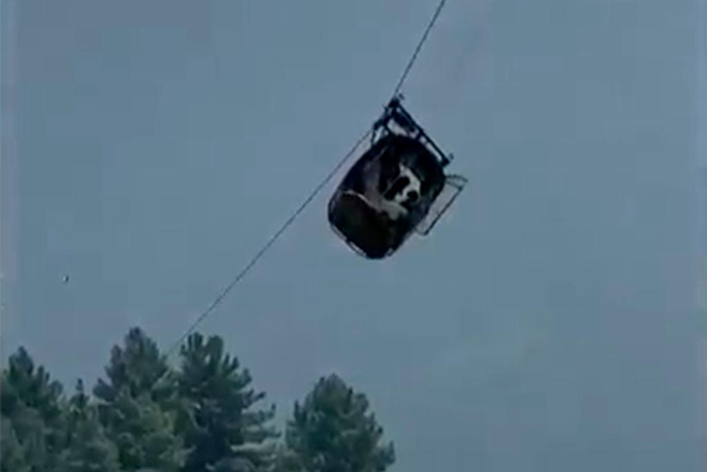 In this image taken from video, a cable car carrying six children and two adults dangles hundreds of meters above the ground in the remote Battagram district, Khyber Pakhtunkhwa, Pakistan on Tuesday, Aug. 22, 2023.