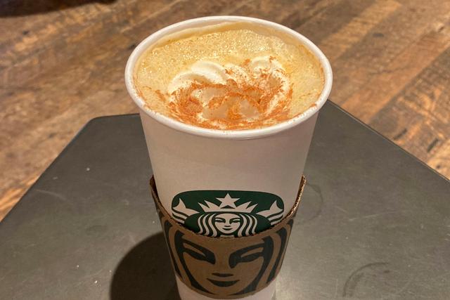 A Pumpkin Spice Latte drink rests on a table at a Starbucks in New York on Thursday, Aug. 24, 2023.