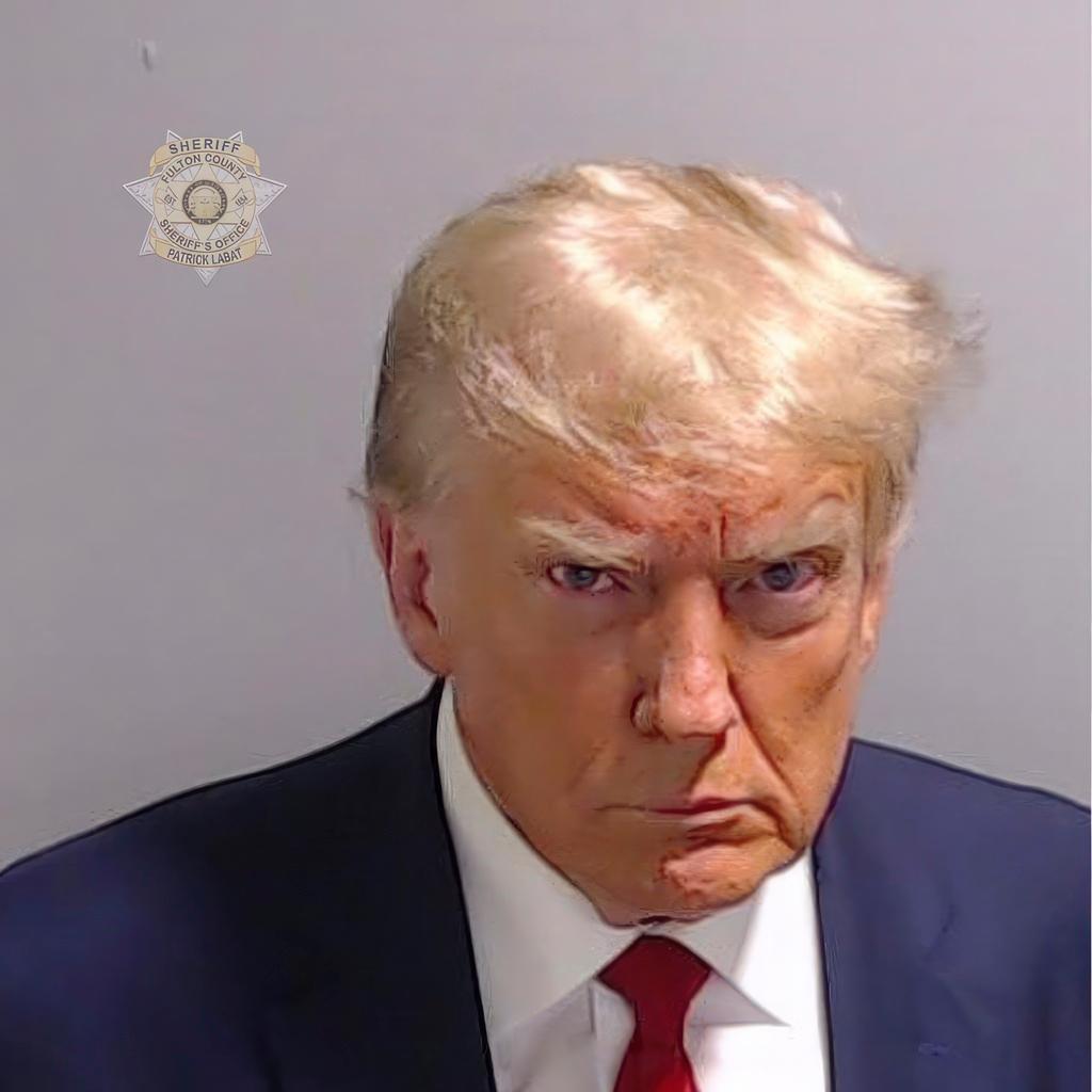 This booking photo provided by Fulton County Sheriff's Office, shows former President Donald Trump 