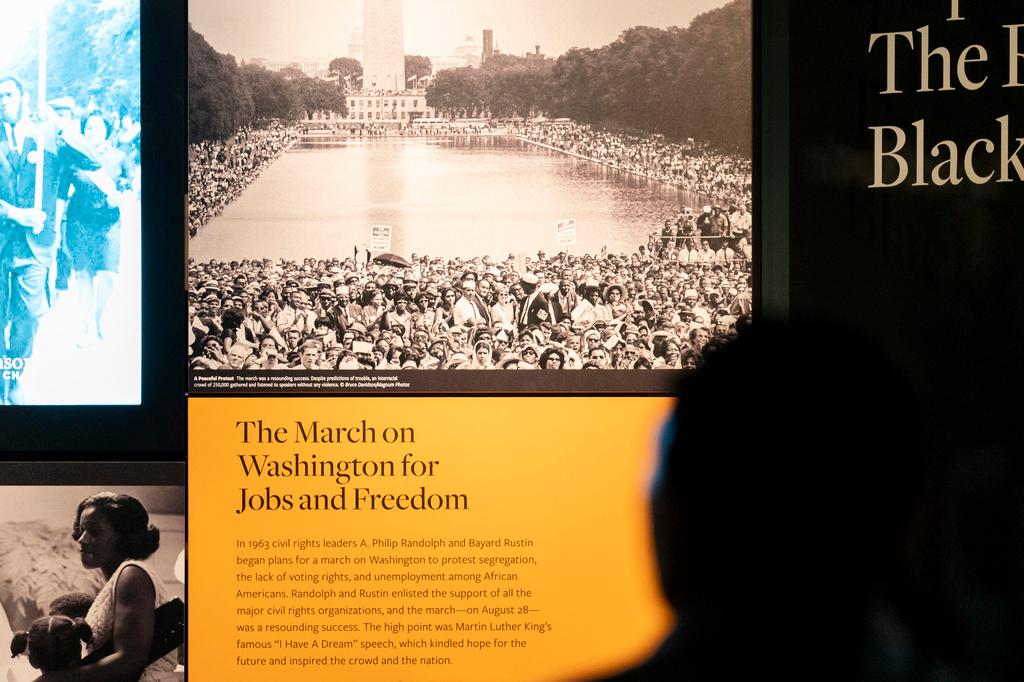 A visitor reads a display about the 1963 March on Washington for Jobs and Freedom at the National Museum of African American History and Culture in Washington