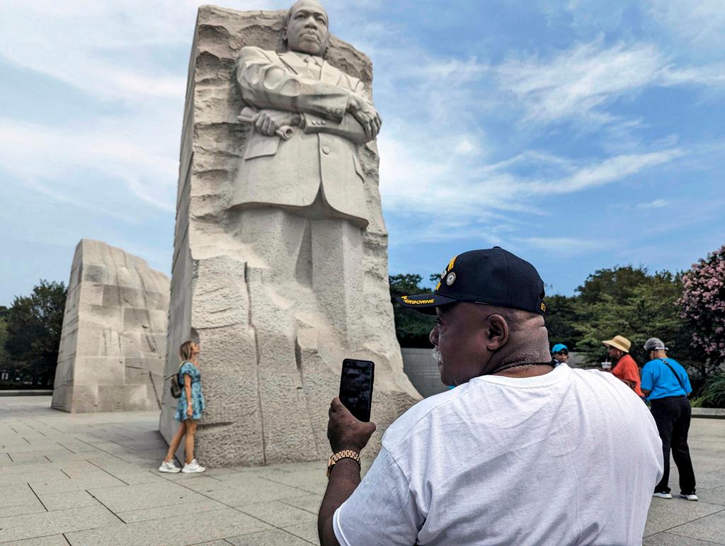 Tommie Babbs, 72, looks at the Martin Luther King Jr. memorial in Washington on Aug. 11, 2023.