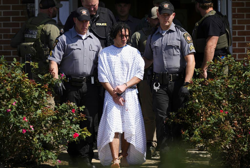 Law enforcement officers escort Danelo Cavalcante from a Pennsylvania State Police barracks in Avondale Pa., on Wednesday, Sept. 13, 2023. Cavalcante was captured Wednesday after eluding hundreds of searchers for two weeks.