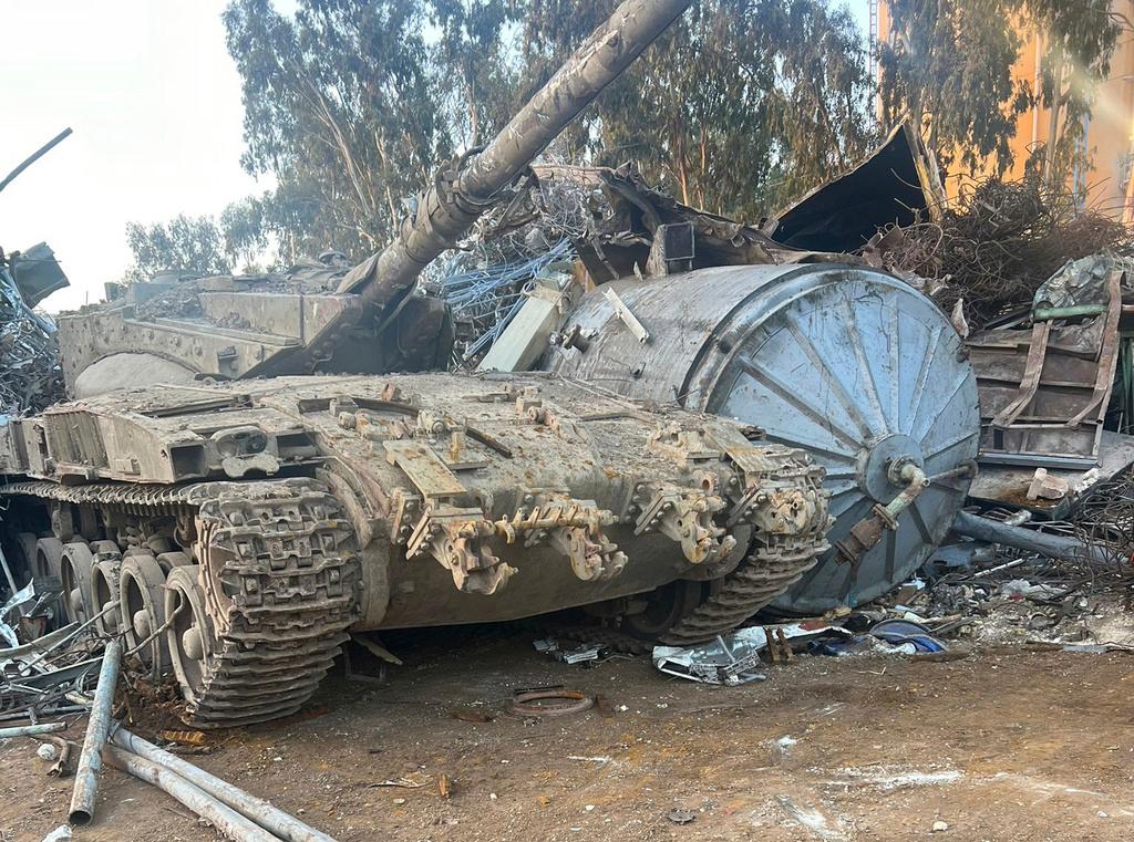 In this photo provided by the Israeli police, an Israeli tank that was stolen from a military zone is seen in a junkyard near Haifa, Israel, Wednesday, Sept. 20, 2022.