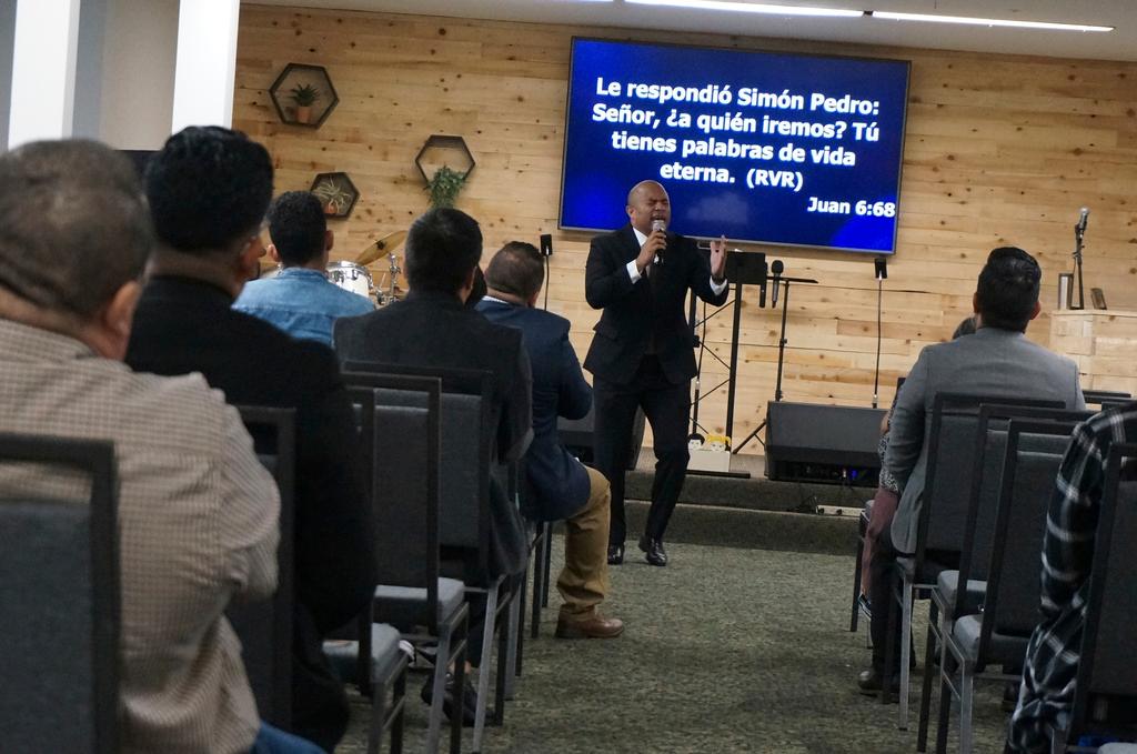 Rev. Gustavo Castillo preaches to his congregation at the Iglesia Pentecostal Unida Latinoamericana in Columbia Heights, Minn.