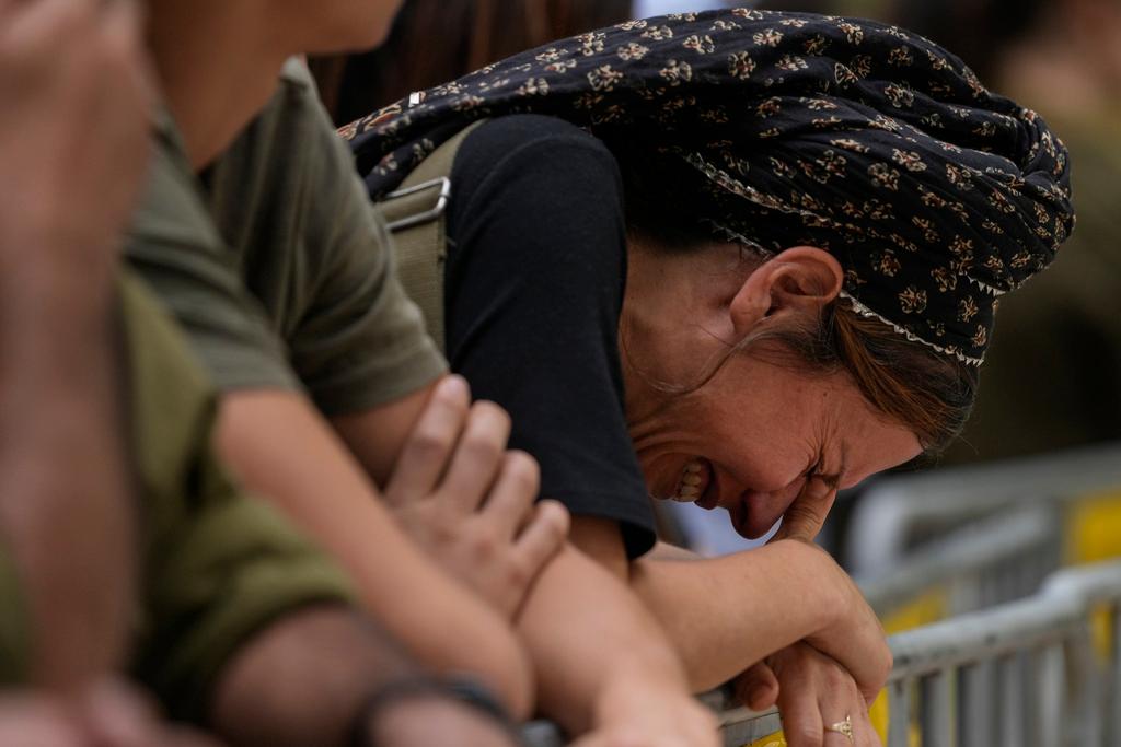 A woman cries during the funeral of Israeli Col. Roi Levy at the Mount Herzl cemetery in Jerusalem 