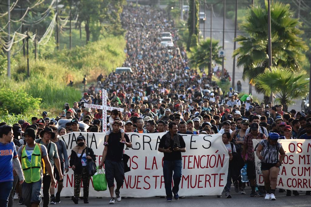 Migrants who had been waiting for temporary transit papers but failed to get them after waiting, some up to two months, leave Tapachula, Mexico