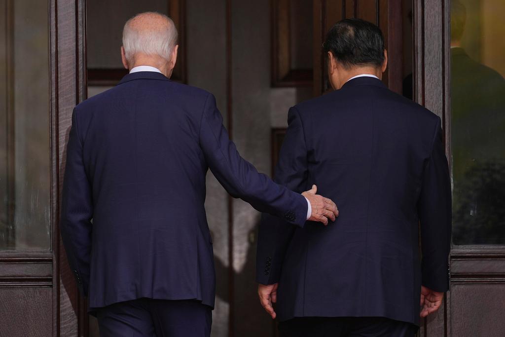 President Joe Biden walks with China's President President Xi Jinping at the Filoli Estate in Woodside, Calif.