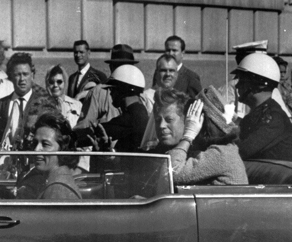  President John F. Kennedy rides in a motorcade with his wife Jacqueline moments before he was shot 