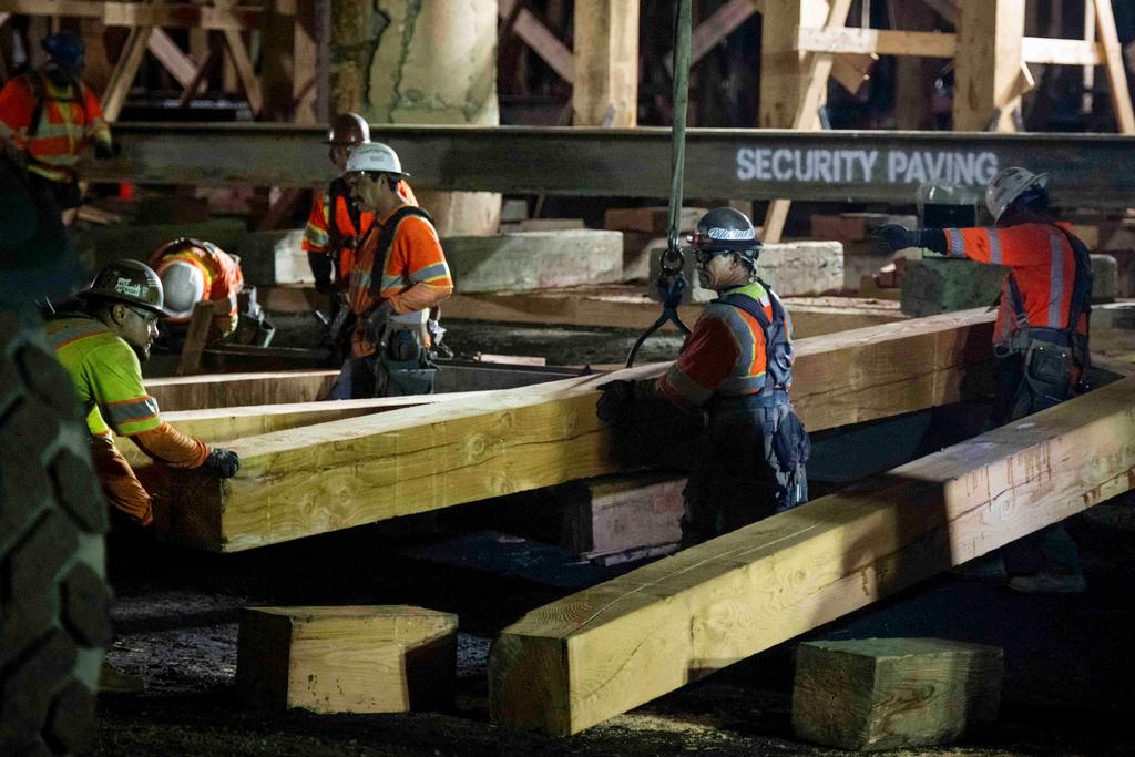 Construction crews shore up the fire-damaged 10 Freeway in Los Angeles 