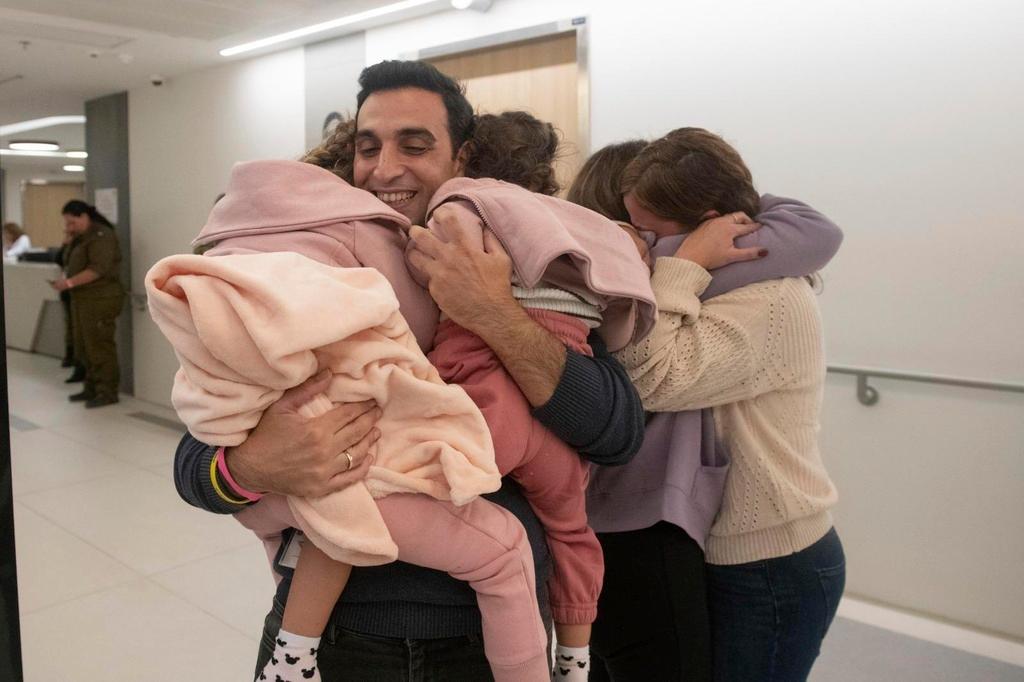 Children Aviv Asher, 2, sister Raz Asher, 4, and mother Doron after they returned to Israel 