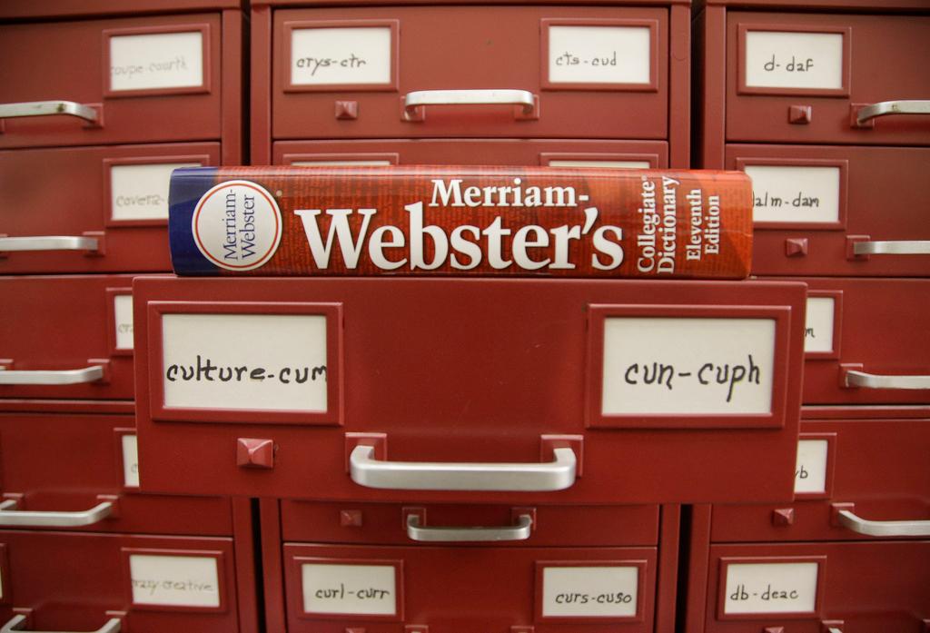 A Merriam-Webster dictionary sits atop their citation files at the dictionary publisher's offices on Dec. 9, 2014, in Springfield, Mass.