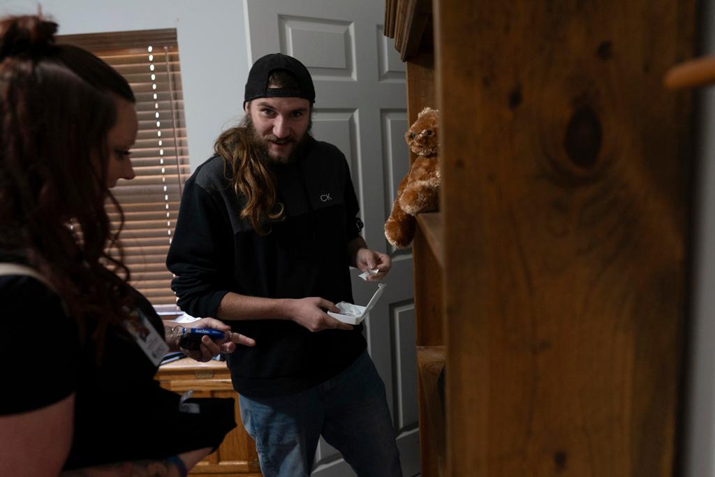 Tyler retrieves fentanyl from his bedroom closet for disposal as his peer support worker encourages