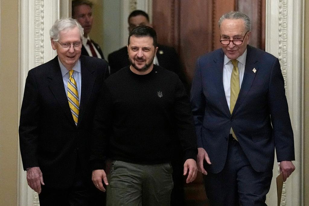 Ukrainian President Volodymyr Zelenskyy walks with Senate Minority Leader Mitch McConnell and Senate Majority Leader Chuck Schumer