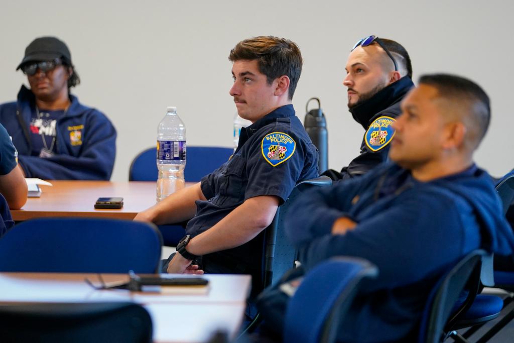 Members of the Baltimore Police Department engage in an exercise during a professional development class