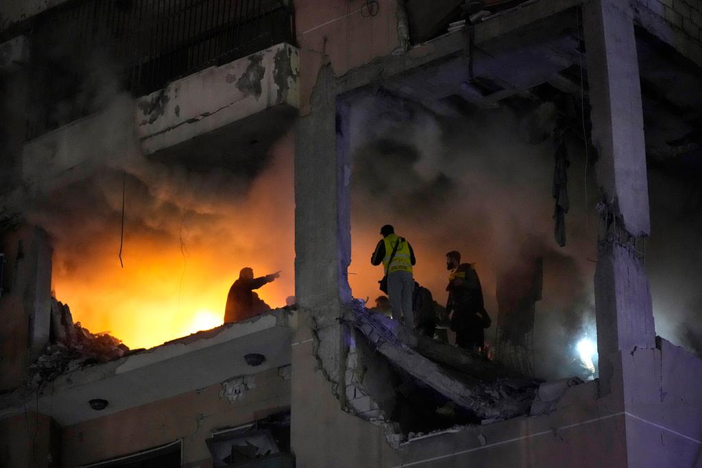 Smoke and flame rise from a destroyed apartment as following a massive explosion in the southern suburb of Beirut, Lebanon